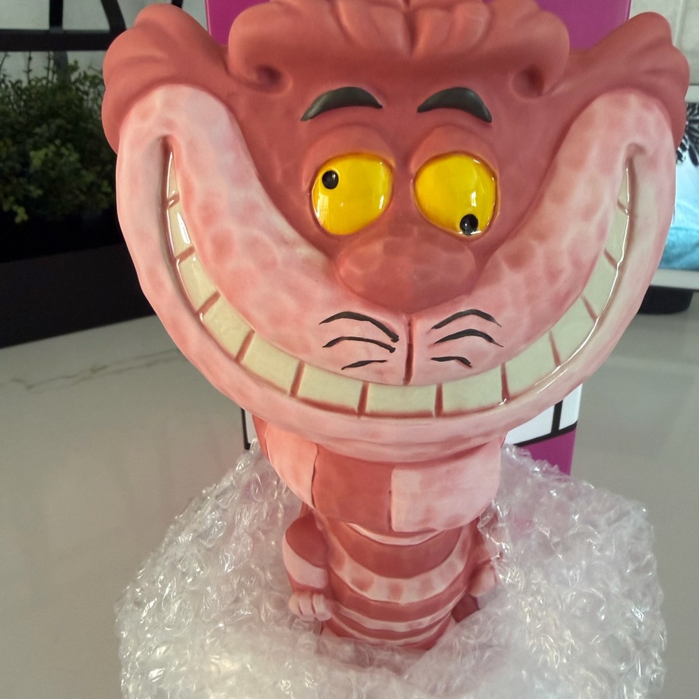 Club 33 exclusive Disney Pink Cheshire Cat mug with Yellow Eyes